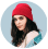 Person wearing red beanie, blue background