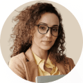 Professional woman wearing glasses and holding a tablet