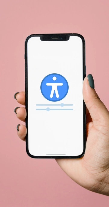 Hand holding smartphone with accessibility settings displayed