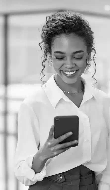 Smiling woman looking at her smartphone