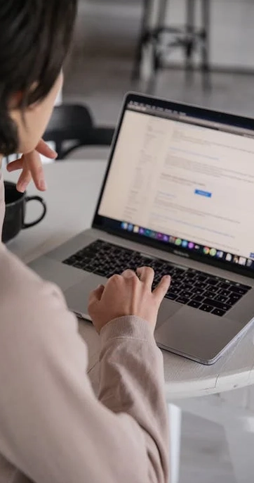 Person typing on a laptop at desk